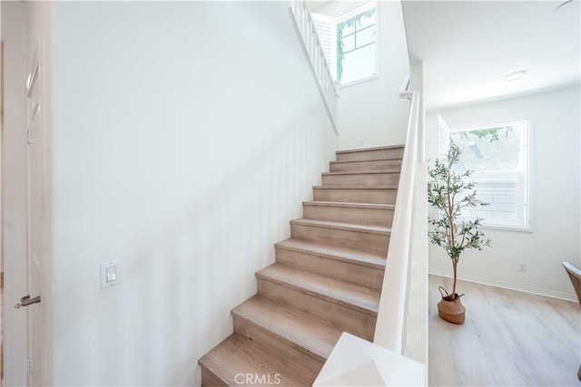 6940 Lagoon Ct, Jurupa Valley, CA 91752 - stairs featuring wood finished floors