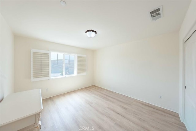 6940 Lagoon Ct, Jurupa Valley, CA 91752 - unfurnished bedroom featuring light wood finished floors and a closet