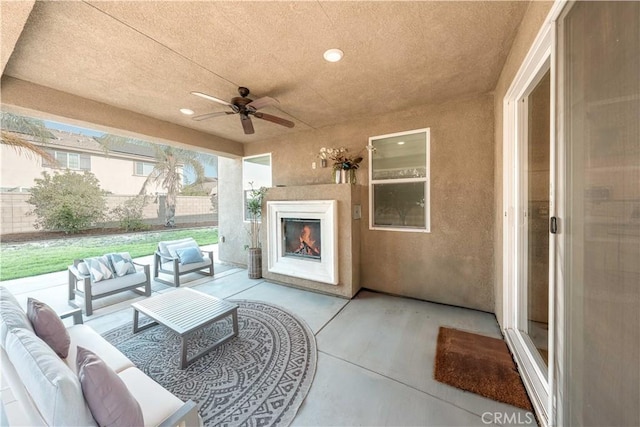 6940 Lagoon Ct, Jurupa Valley, CA 91752 - view of patio featuring an outdoor living space with a fireplace and ceiling fan