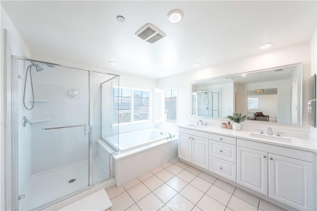 6940 Lagoon Ct, Jurupa Valley, CA 91752 - bathroom with double vanity, a garden tub, a shower stall, and tile patterned flooring