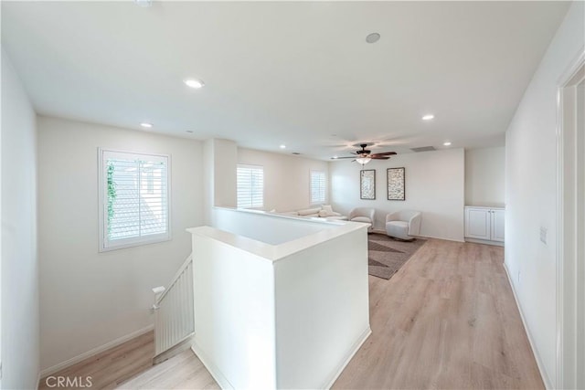 6940 Lagoon Ct, Jurupa Valley, CA 91752 - hallway with an upstairs landing, light wood-type flooring, and recessed lighting