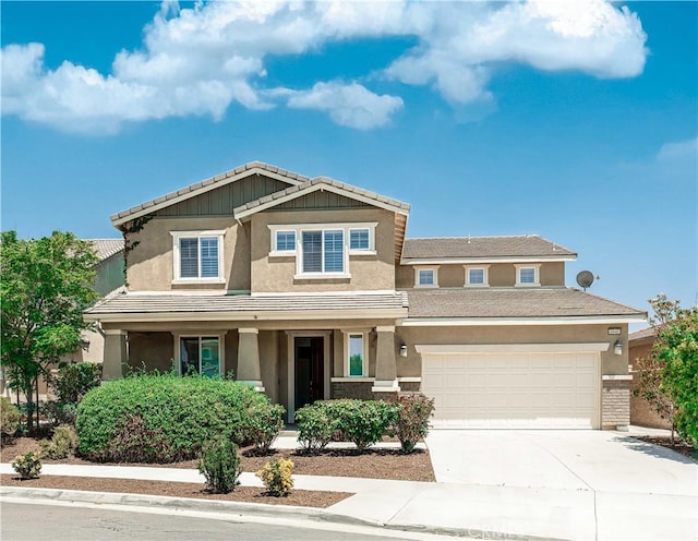 6940 Lagoon Ct, Jurupa Valley, CA 91752 - view of front facade with stucco siding, driveway, covered porch, and a tiled roof