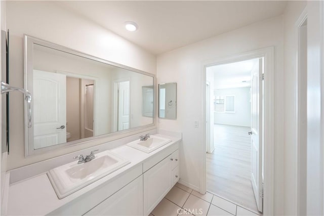 6940 Lagoon Ct, Jurupa Valley, CA 91752 - bathroom with double vanity and tile patterned floors