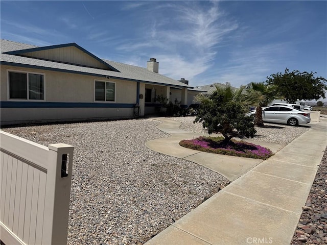 13484 Franceska Rd, Apple Valley, CA 92308 - view of front facade featuring a chimney and a shingled roof