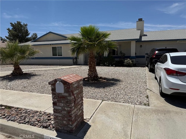 13484 Franceska Rd, Apple Valley, CA 92308 - single story home with an attached garage, a chimney, and stucco siding