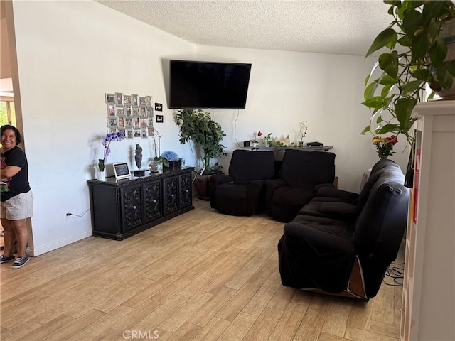 13484 Franceska Rd, Apple Valley, CA 92308 - living area featuring light wood-type flooring and a textured ceiling