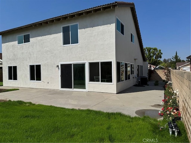 135 Ricci Ave, Walnut, CA 91789 - rear view of house featuring central AC, a patio area, and stucco siding