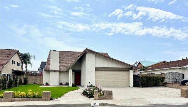 135 Ricci Ave, Walnut, CA 91789 - view of front of property with a tiled roof, concrete driveway, a garage, and stucco siding