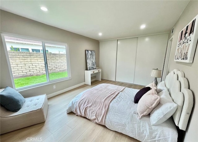 135 Ricci Ave, Walnut, CA 91789 - bedroom with light wood-style floors, recessed lighting, a closet, and baseboards
