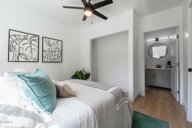 3538 Sierra St, Los Angeles, CA 90031 - bedroom with light wood-type flooring, a sink, ensuite bathroom, and a ceiling fan
