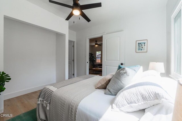 3538 Sierra St, Los Angeles, CA 90031 - bedroom with wood finished floors, baseboards, multiple windows, and ceiling fan