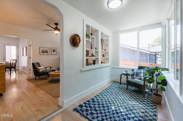 3538 Sierra St, Los Angeles, CA 90031 - living area with wood finished floors, ceiling fan, arched walkways, and baseboards
