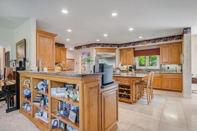 4014 Millagra Dr, Fallbrook, CA 92028 - kitchen featuring a breakfast bar area, recessed lighting, tasteful backsplash, stone countertops, and a center island