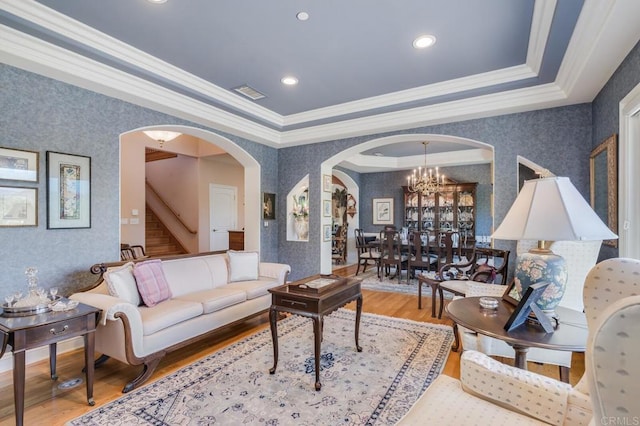 4014 Millagra Dr, Fallbrook, CA 92028 - living room with wallpapered walls, arched walkways, ornamental molding, wood finished floors, and stairway