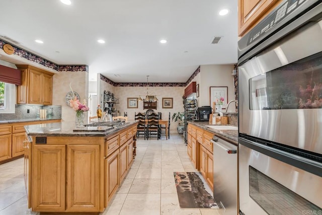 4014 Millagra Dr, Fallbrook, CA 92028 - kitchen with appliances with stainless steel finishes, a sink, recessed lighting, backsplash, and dark stone countertops
