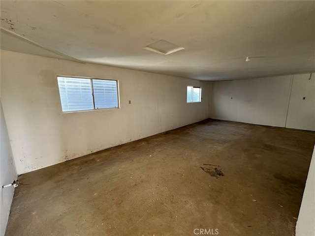 60645 Lupin Ln, Anza, CA 92539 - spare room with concrete flooring and attic access