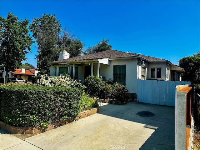 10802 Morrison St, North Hollywood, CA 91601 - view of front of home featuring stucco siding and a chimney
