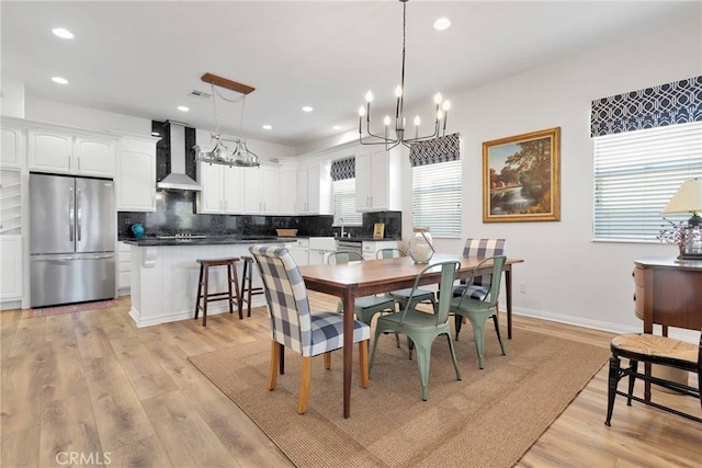 19344 Macklin St, Apple Valley, CA 92308 - dining space with a chandelier, plenty of natural light, recessed lighting, and light wood-style flooring