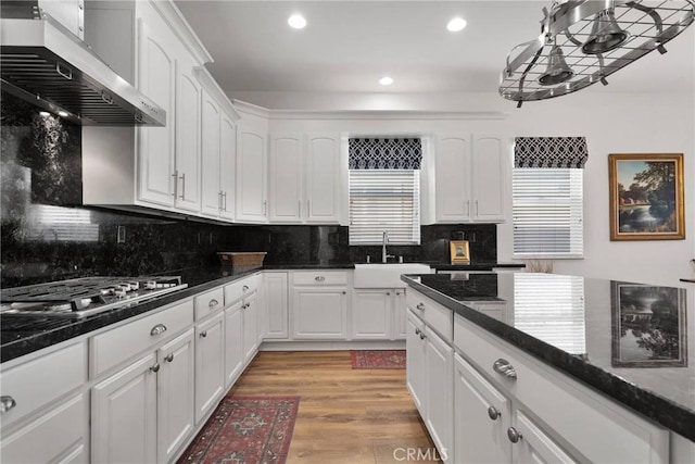 19344 Macklin St, Apple Valley, CA 92308 - kitchen with ventilation hood, a sink, stainless steel gas stovetop, recessed lighting, and white cabinets
