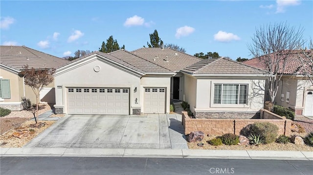 19344 Macklin St, Apple Valley, CA 92308 - ranch-style house with a garage, stone siding, stucco siding, driveway, and a tile roof