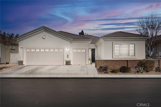 19344 Macklin St, Apple Valley, CA 92308 - single story home featuring a garage, driveway, stucco siding, and a tiled roof