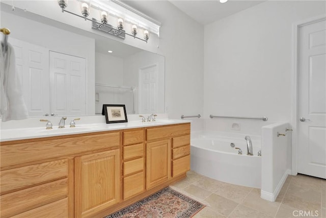 19344 Macklin St, Apple Valley, CA 92308 - bathroom featuring a bath, double vanity, and tile patterned flooring