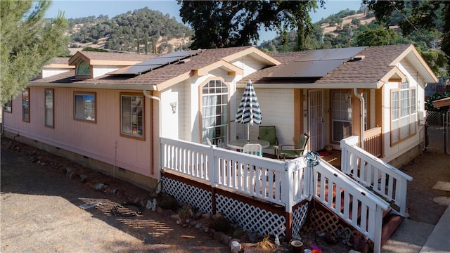 13182 Third St, Clearlake Oaks, CA 95423 - view of front of property featuring crawl space, solar panels, and roof with shingles