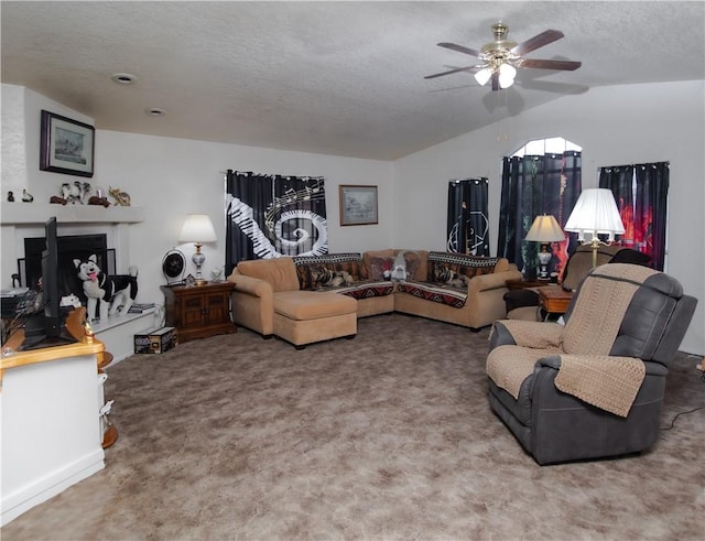 13182 Third St, Clearlake Oaks, CA 95423 - living area featuring vaulted ceiling, a ceiling fan, carpet flooring, and a textured ceiling