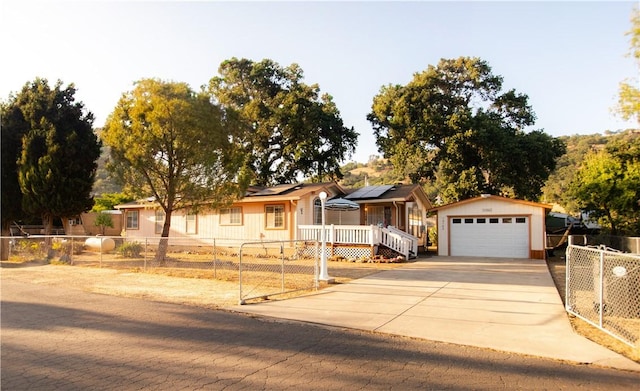 13182 Third St, Clearlake Oaks, CA 95423 - single story home with a fenced front yard, a garage, solar panels, an outdoor structure, and a deck