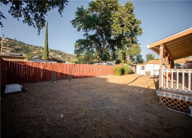 13182 Third St, Clearlake Oaks, CA 95423 - view of yard with an outbuilding and a wooden deck