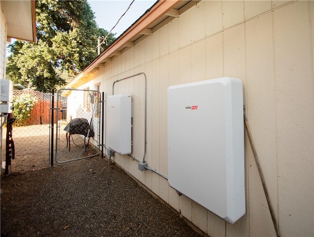 13182 Third St, Clearlake Oaks, CA 95423 - exterior view of wall-mounted power storage and a gate