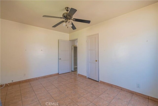 7227 Farmland Ave, Pico Rivera, CA 90660 - empty room with a ceiling fan and baseboards