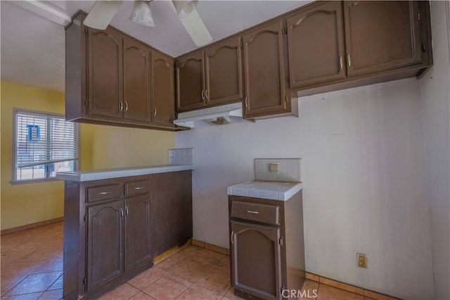 7227 Farmland Ave, Pico Rivera, CA 90660 - kitchen with baseboards and light tile patterned flooring