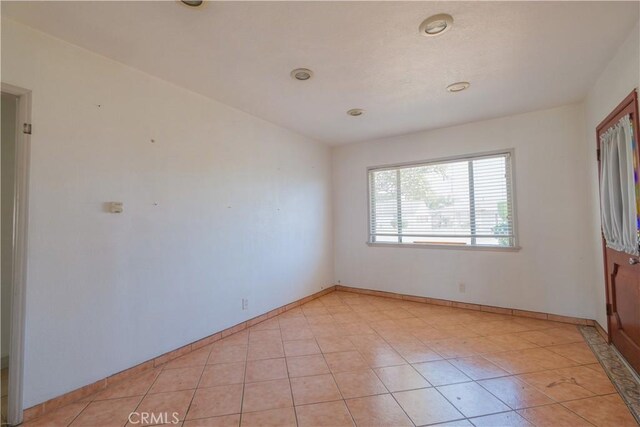 7227 Farmland Ave, Pico Rivera, CA 90660 - empty room featuring baseboards and light tile patterned floors