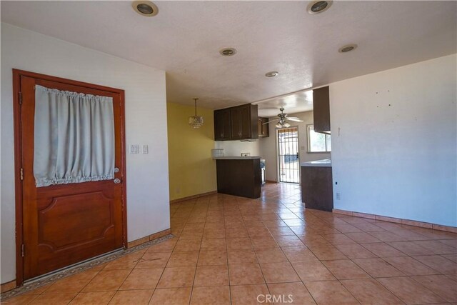 7227 Farmland Ave, Pico Rivera, CA 90660 - entryway with ceiling fan, baseboards, and light tile patterned flooring