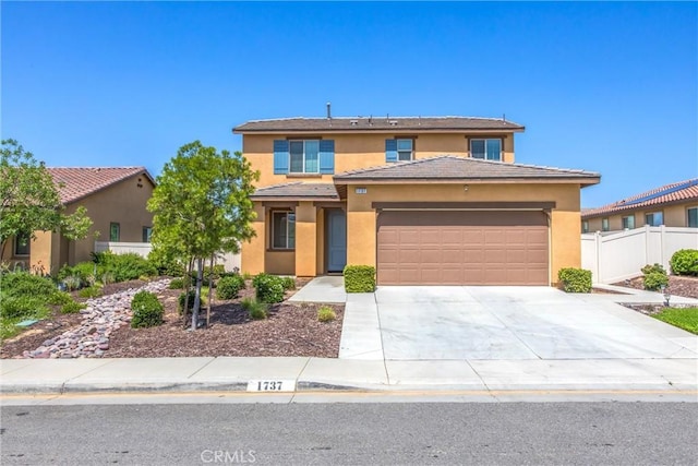 1737 Arcus Ct, Beaumont, CA 92223 - view of front of house with a garage, stucco siding, concrete driveway, and a tiled roof