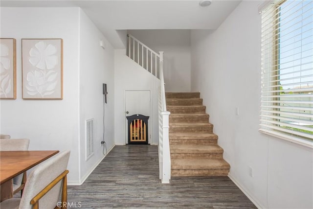 1737 Arcus Ct, Beaumont, CA 92223 - stairs featuring wood finished floors, healthy amount of natural light, and baseboards