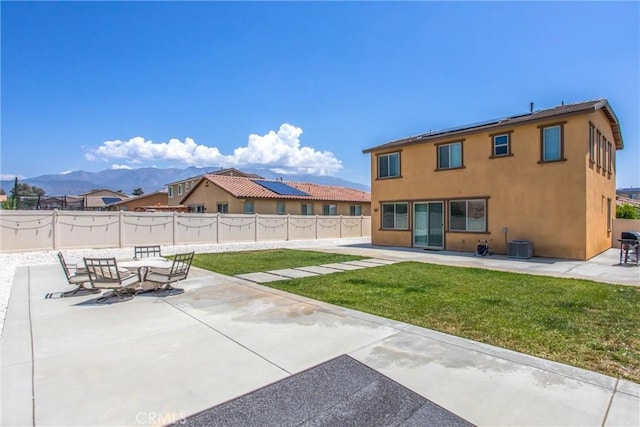 1737 Arcus Ct, Beaumont, CA 92223 - rear view of property featuring a patio, stucco siding, roof mounted solar panels, and central air condition unit