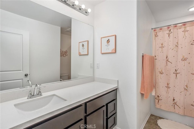 1737 Arcus Ct, Beaumont, CA 92223 - full bathroom featuring toilet, vanity, baseboards, and shower / tub combo
