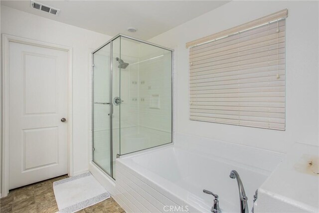 1737 Arcus Ct, Beaumont, CA 92223 - full bathroom featuring a shower stall and a bath