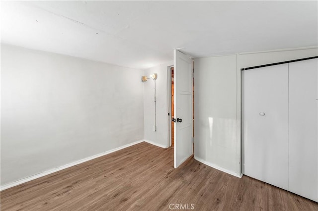 59485 State Highway 74, Mountain Center, CA 92561 - unfurnished bedroom with wood finished floors, a closet, and baseboards