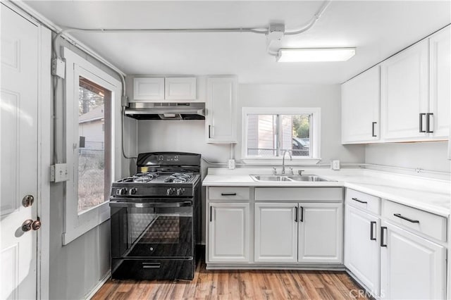 59485 State Highway 74, Mountain Center, CA 92561 - kitchen with black gas stove, a sink, under cabinet range hood, and healthy amount of natural light