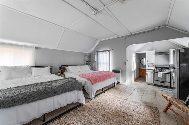 59485 State Highway 74, Mountain Center, CA 92561 - bedroom featuring lofted ceiling, freestanding refrigerator, and light tile patterned floors