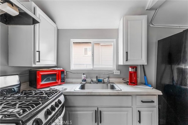59485 State Highway 74, Mountain Center, CA 92561 - kitchen featuring stainless steel range with gas cooktop, a sink, range hood, light countertops, and white cabinets