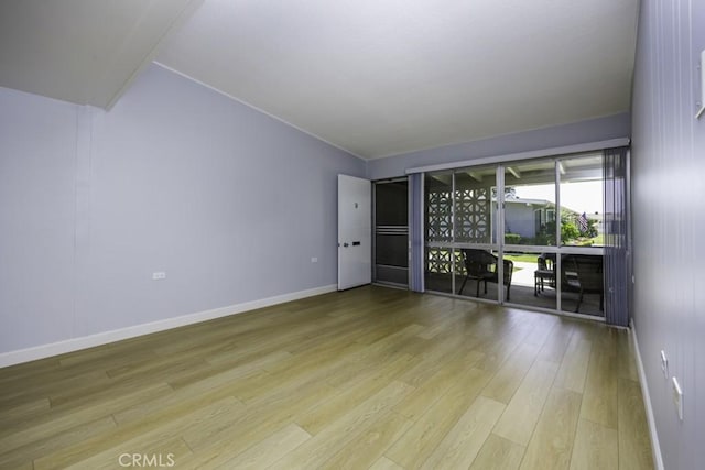 13881 Thunderbird Dr Unit M1-63E, Seal Beach, CA 90740 - unfurnished room featuring light wood-style flooring and baseboards