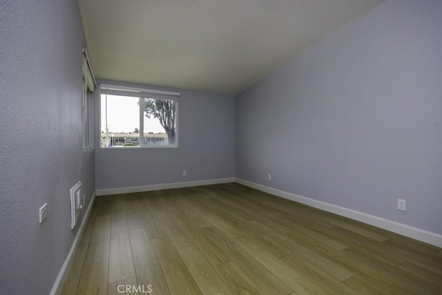 13881 Thunderbird Dr Unit M1-63E, Seal Beach, CA 90740 - spare room with wood finished floors and baseboards