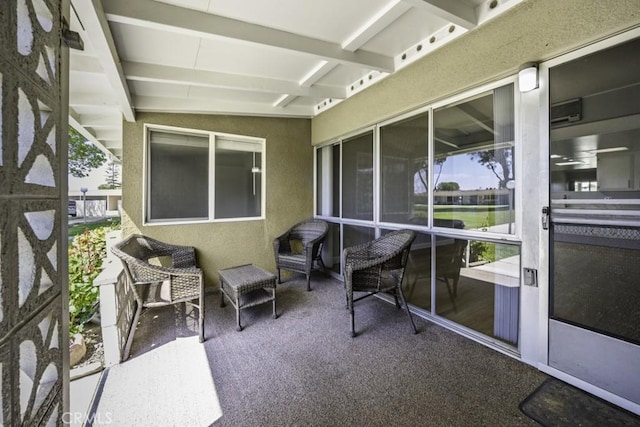 13881 Thunderbird Dr Unit M1-63E, Seal Beach, CA 90740 - sunroom with healthy amount of natural light and beam ceiling