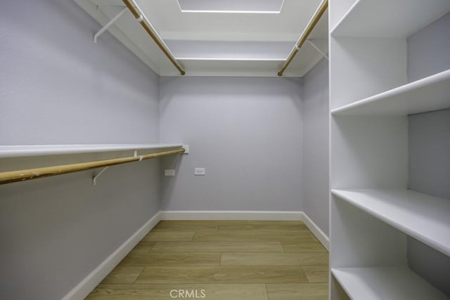 13881 Thunderbird Dr Unit M1-63E, Seal Beach, CA 90740 - walk in closet with light wood-type flooring