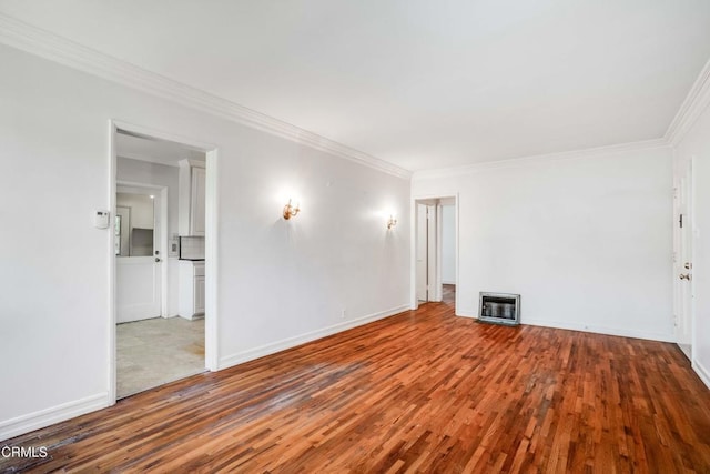 8730 Marshall St, Rosemead, CA 91770 - unfurnished room featuring heating unit, wood finished floors, ornamental molding, and baseboards
