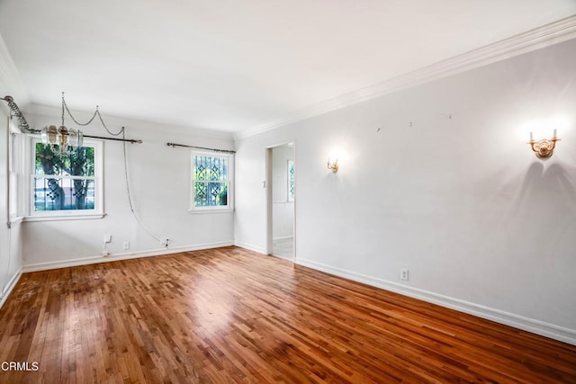 8730 Marshall St, Rosemead, CA 91770 - empty room featuring crown molding, wood finished floors, baseboards, and a chandelier